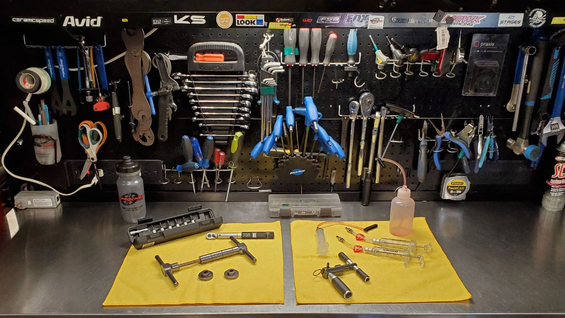 Sprocket Cycles workshop tool wall and bench